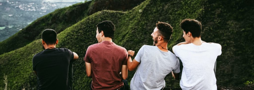 men talking outdoors