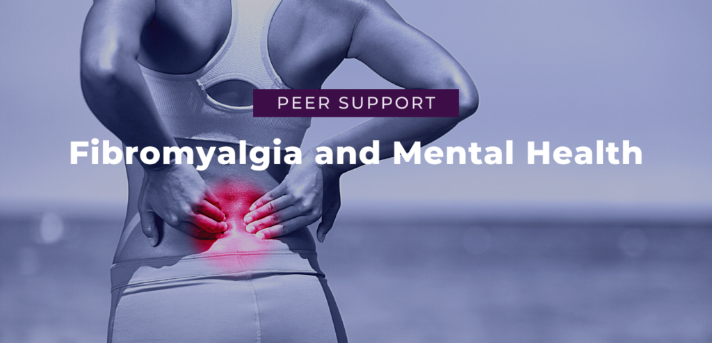 women holding lower back in pain