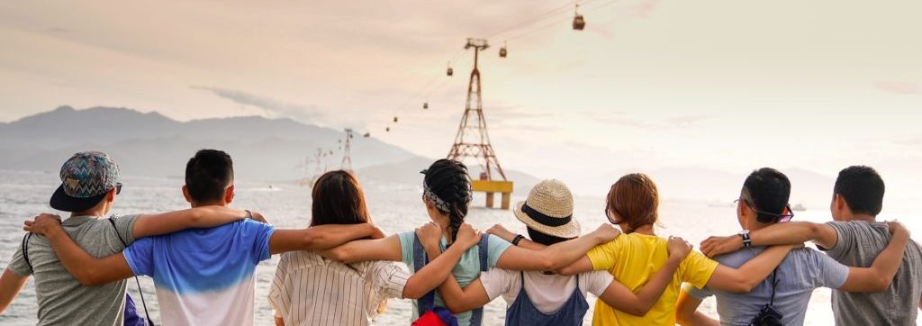 people hugging looking out into the water