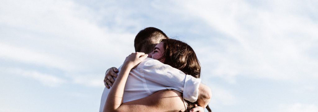 Two people hugging